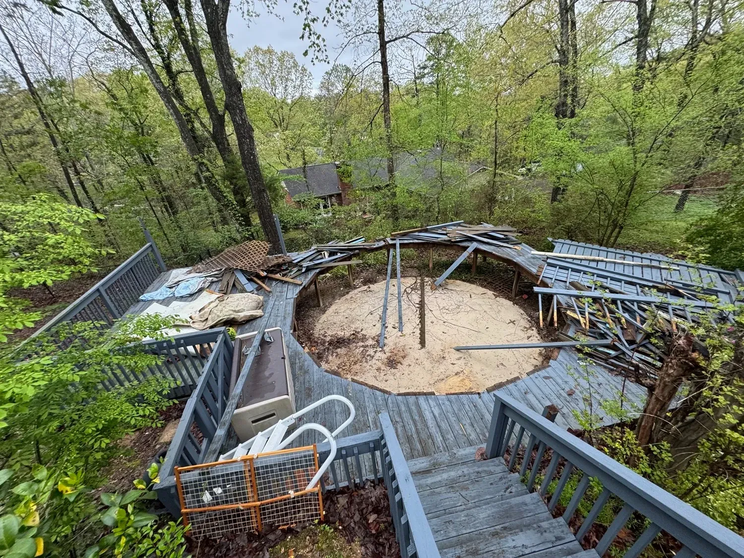 Damaged deck surrounded by trees