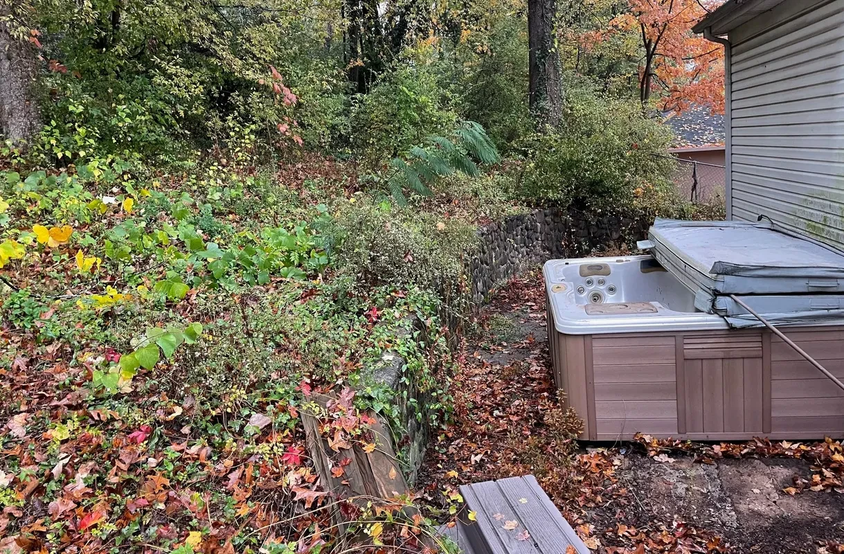 Hot tub surrounded by autumn foliage