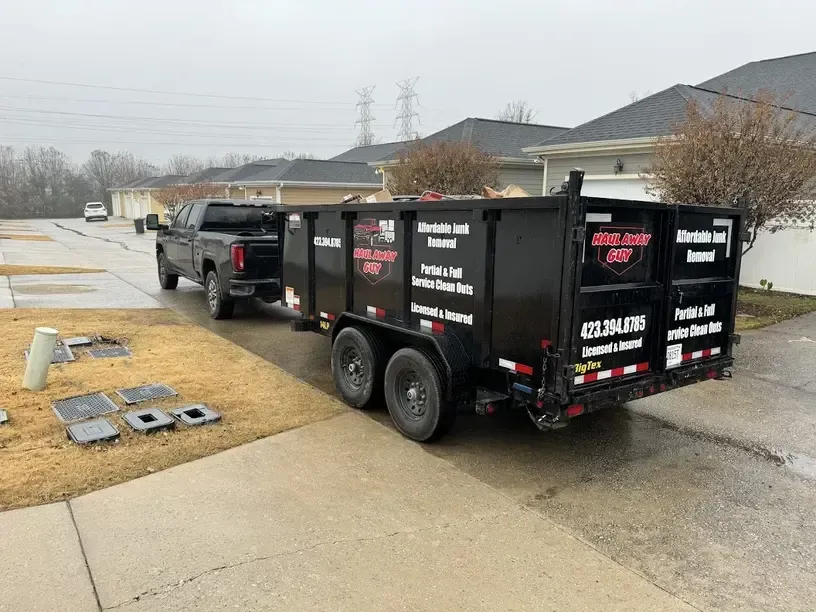 Black trailer attached to pickup truck