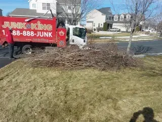 Truck collecting yard waste debris