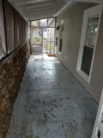 Empty hallway with stone wall