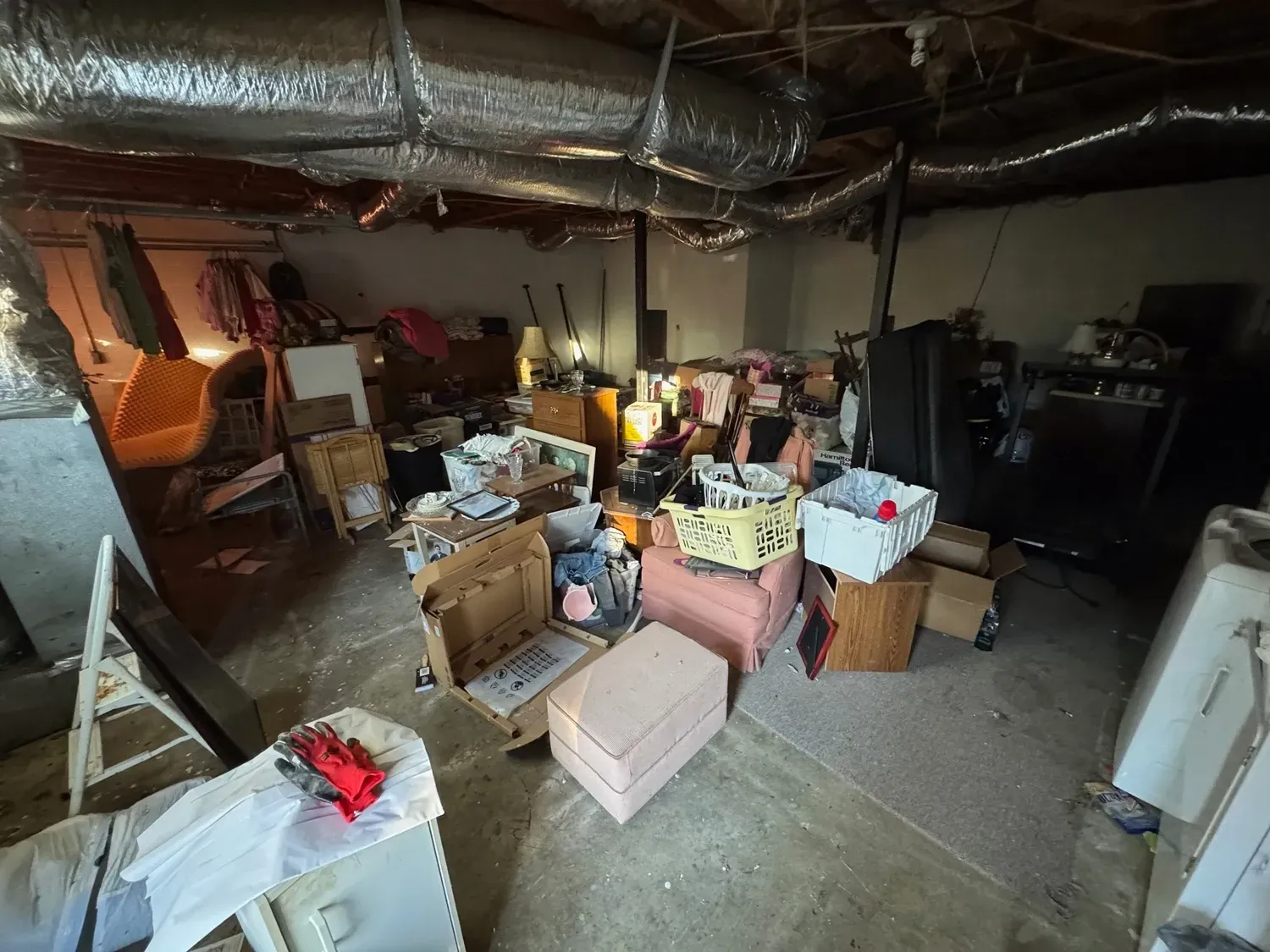 Cluttered basement filled with boxes.