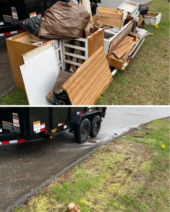Debris piled near a trailer.