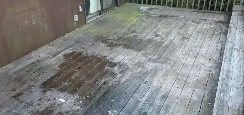 Dirty, weathered wooden deck surface