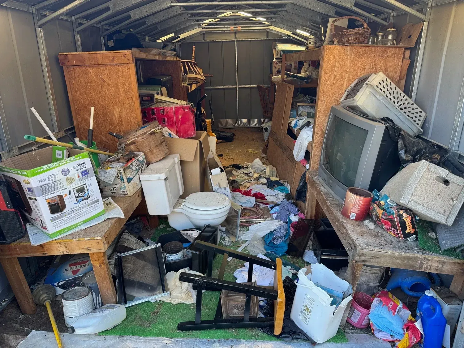 Cluttered storage space filled with debris