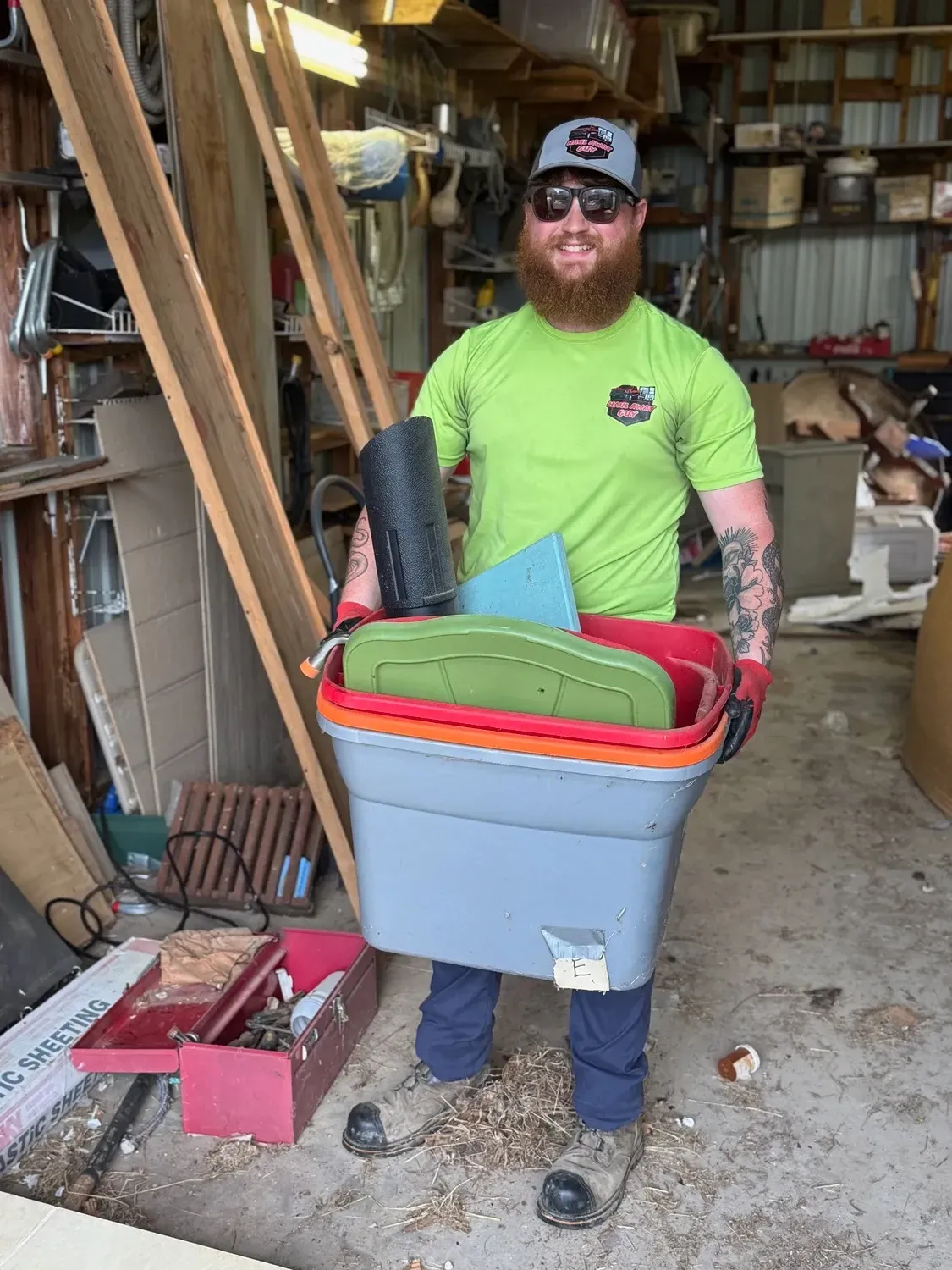 Person holding a bucket of items.