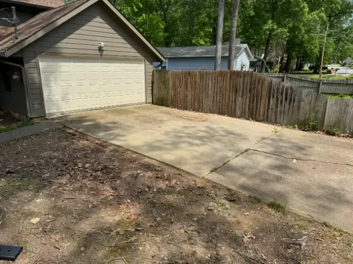 Concrete area beside a house.